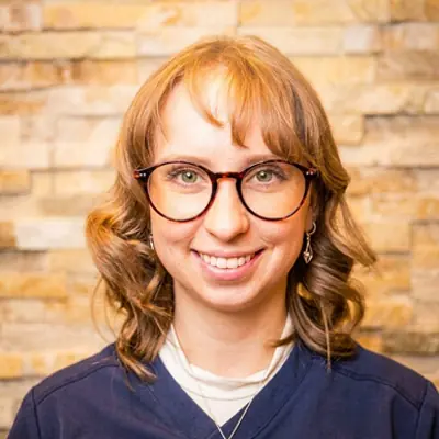 Claire, a Chiropractic Assistant, smiling at the camera